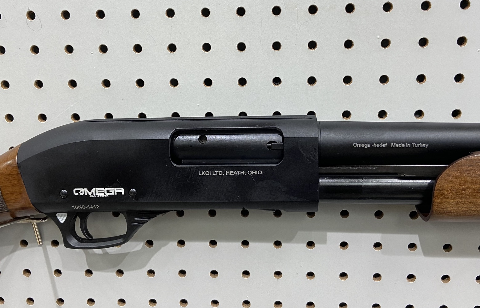 Omega P12m 12ga pump shotgun